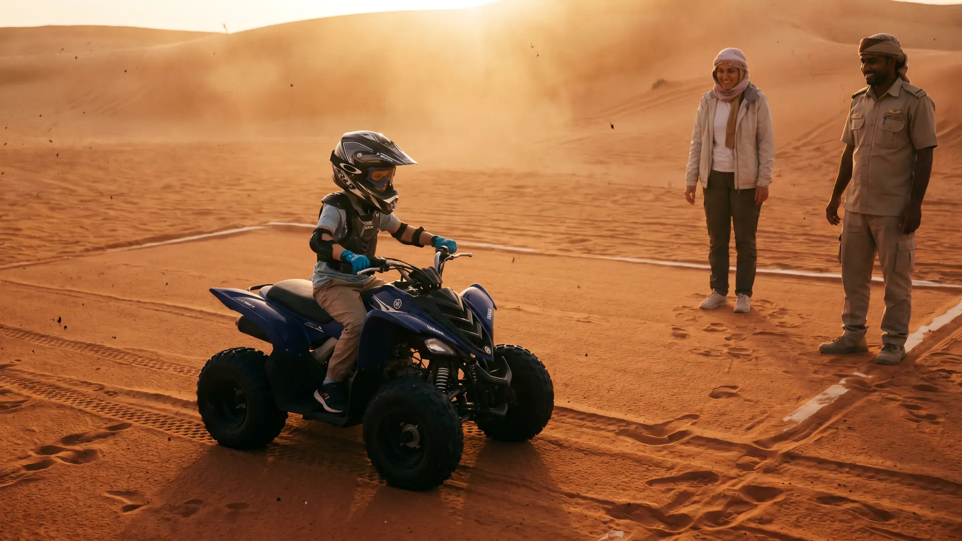 Child on a supervised 90cc ATV track in the Dubai desert